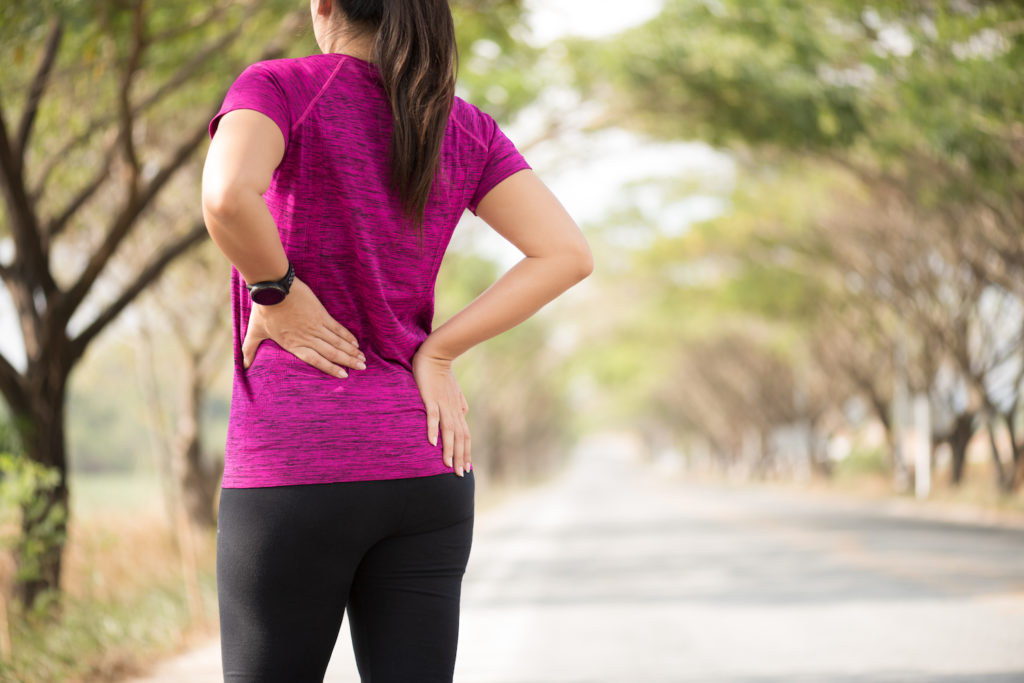 exercising woman suffer from back pain