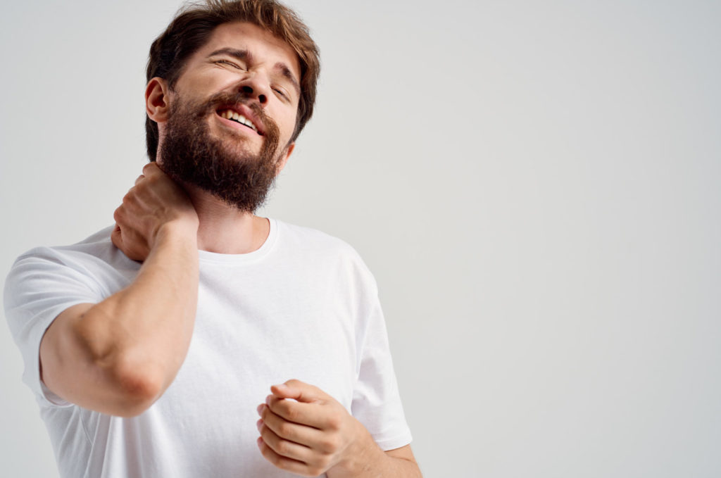 bearded man suffer from neck pain