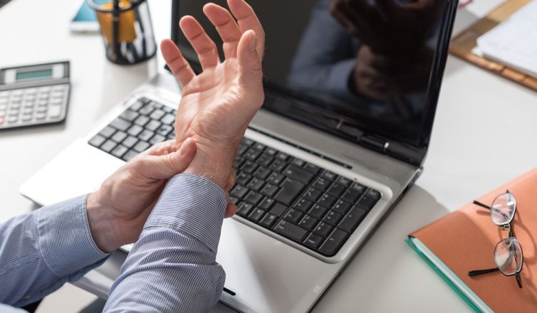 businessman suffering from wrist pain