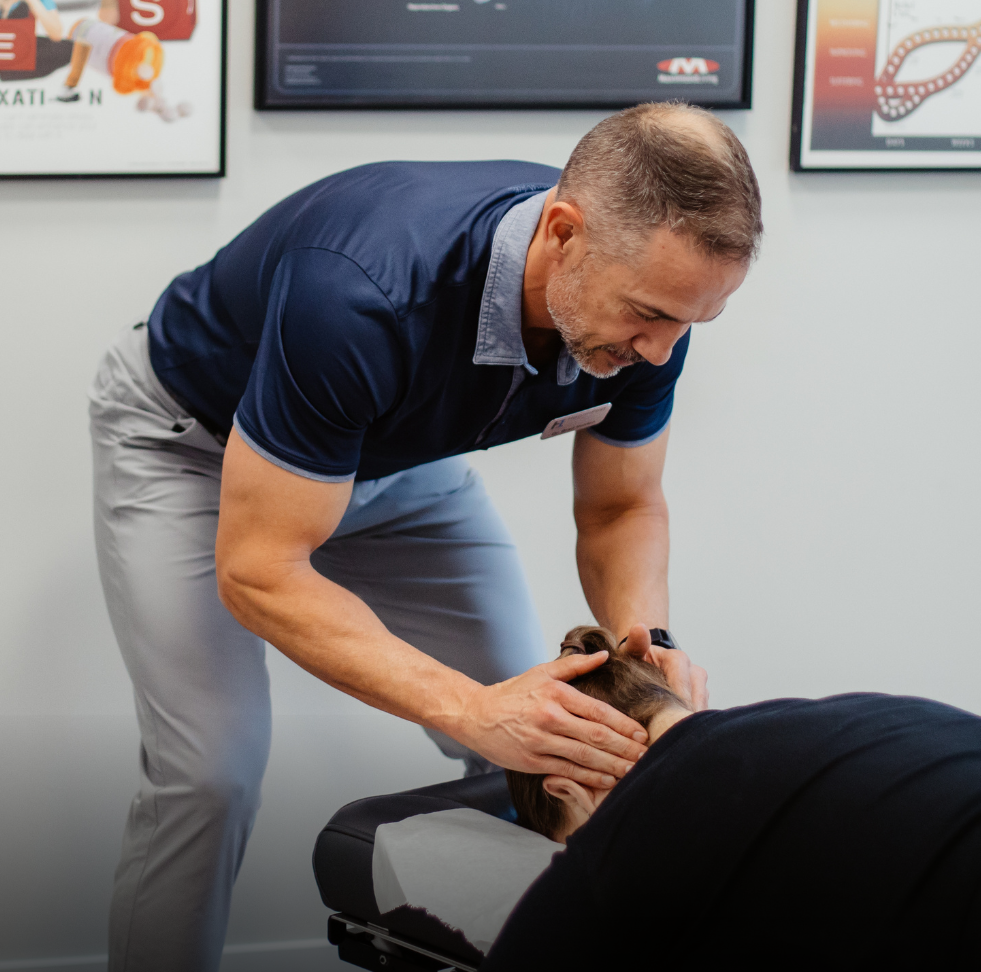 Dr. Brad Holden attend patients neck pain treatment